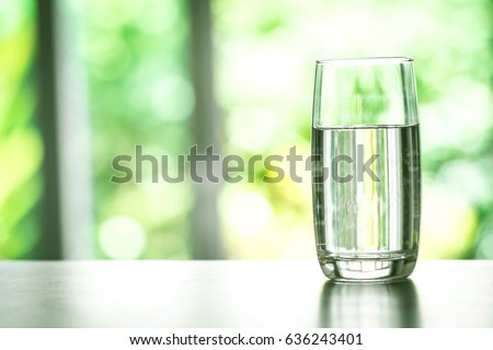 Close up the purified fresh drink water from the bottle on table in living room Royalty-Free Stock Photo #636243401