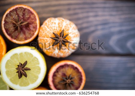 Variety of citrus fruits sliced and cut. Orange, lemon, lime, grapefruit and badian as decoration. Concept of healthy life fresh fruits variety of colors.