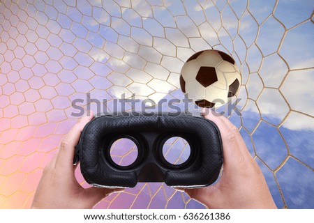 Technology, gaming, entertainment or 3d glasses.VR headset glasses and background soccer ball in net.