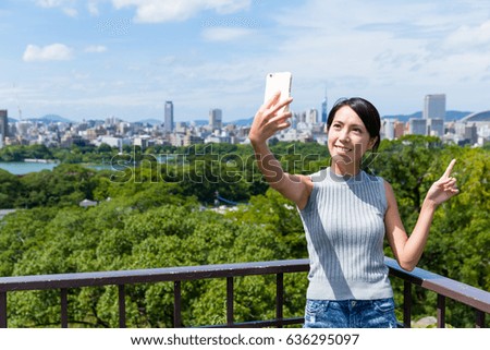 Woman travel in fukuoka and takeing selfie