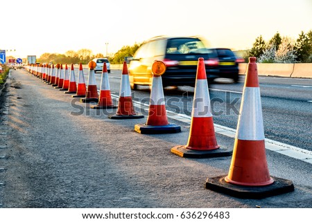 Evening view UK Motorway Services Roadworks Cones Royalty-Free Stock Photo #636296483