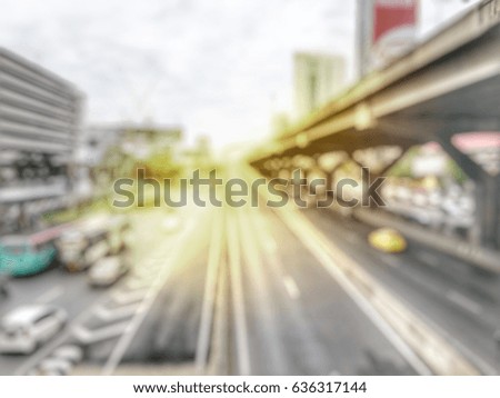abstract blurred image of Evening traffic jam on road, blur of vehicles cars, saloon, bus, motorcycle, people at the road : out of focus concept in the city Bangkok Thailand.