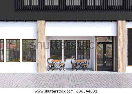 Cafe exterior with white walls and two wooden tables with chairs standing near a door. 3d rendering