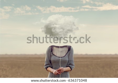 Woman's head hidden by a soft cloud Royalty-Free Stock Photo #636371048