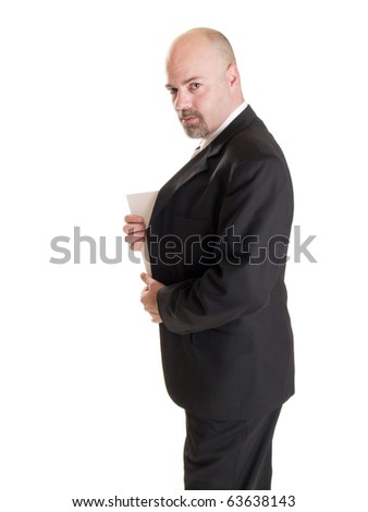 Isolated stock photo of a caucasian businessman looking at the camera while showing the corner of a secret document he has hidden in his coat.