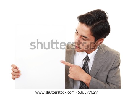 Asian businessman pointing