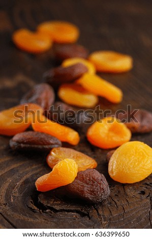 dried apricots on rustic background, orange and brown color