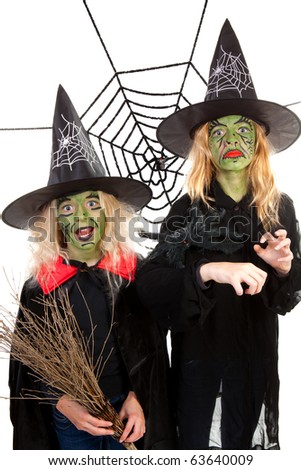 Scary green witches for Halloween with spiderweb over white background