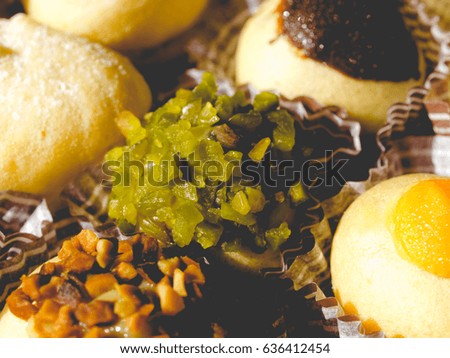 Mixed pastries with chocolate, cream, fruit, vintage faded look