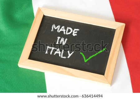 Italian flag and a chalkboard with the slogan Made in Italy