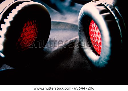 close up black and red headphone on blalk silk