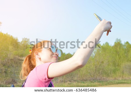 The girl makes selfie
