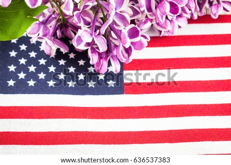Fresh spring purple lilac and flag for spring and patriotic holidays