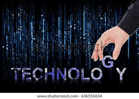 male hand placing letters to form the word technology