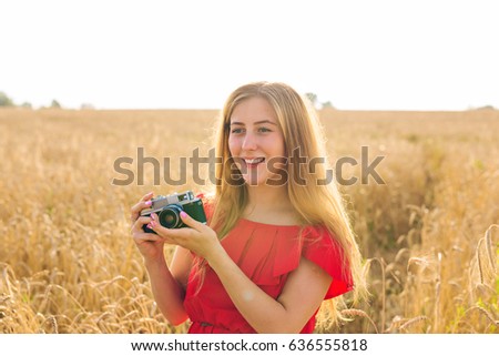 Woman with retro photo camera. Fashion Travel Lifestyle outdoor concept