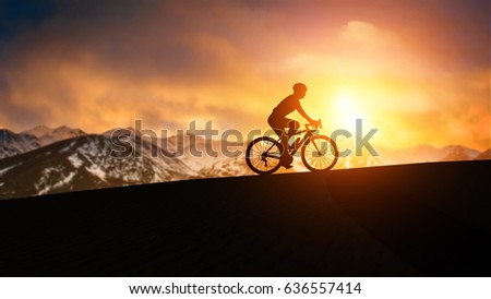 silhouette bicycle on sunset mountain background Royalty-Free Stock Photo #636557414