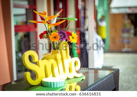 Colorful flower shield smile