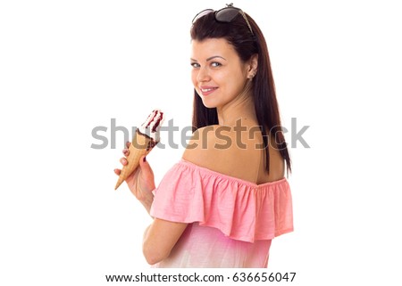 Woman in dress with sunglasses holding ice-cream