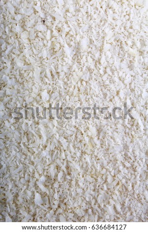 Desiccated coconut texture pattern as background.