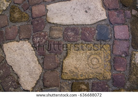 old paving with different stones