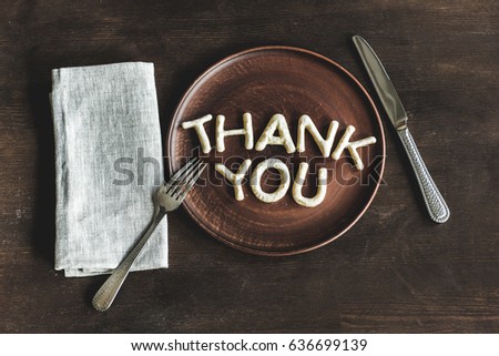 top view of thank you lettering made from cookie dough on wooden plate Royalty-Free Stock Photo #636699139