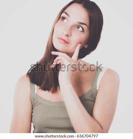 Young woman standing, isolated on white background