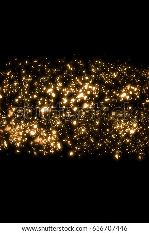Golden abstract shimmering sparkles or glitter lights. Festive gold background. Defocused circles bokeh or particles. Template for design