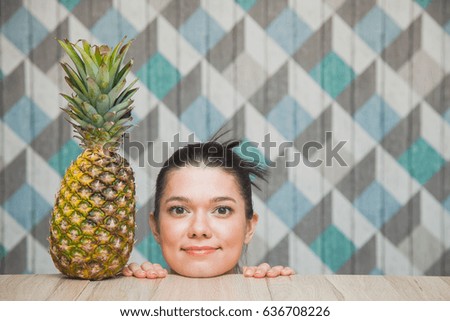 Happy young girl head with fresh sweet pineapple copy space summer concept