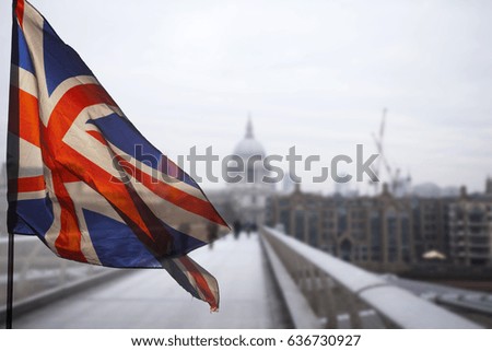  Union Jack flag and iconic London landmarks in the background - Brexit concept