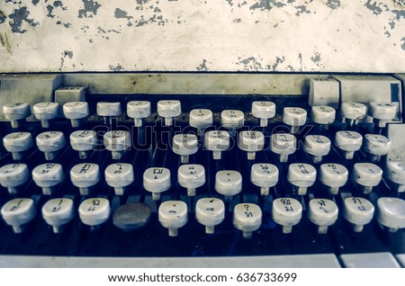 Selective focus and close up on press button of the old typing machine with effect filter.