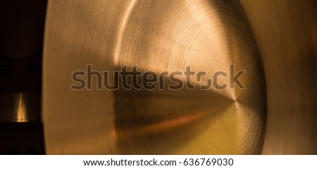 Metallic background, center dome, cut, reflection at edge. Golden.