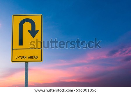 u-turn ahead On the sky background