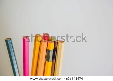 Colors pencils, colorful many crayons on white background .