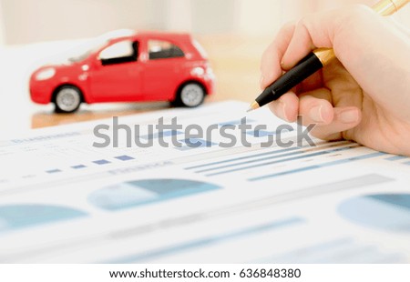 Businesswoman holding a pen and analyze data