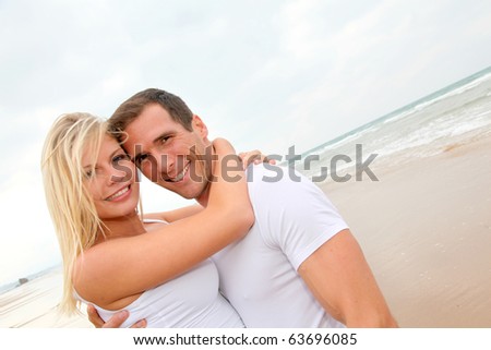 Couple having fun on a sandy beach