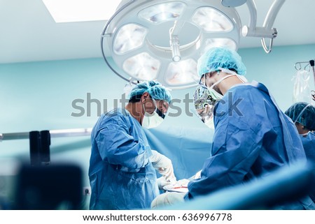Team of Surgeons Operating in the Hospital. Royalty-Free Stock Photo #636996778