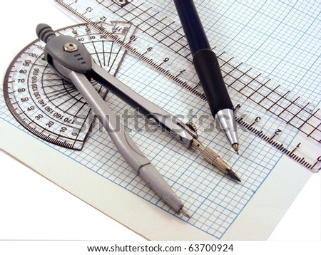 Geometry set with compass,pen,ruler & protractor on graph paper