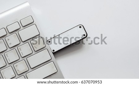 Office desk table keyboard and flash drive on white background