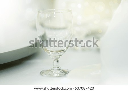 Glass of wine on an elegant background.Table set for an event party or wedding reception.selective focus.