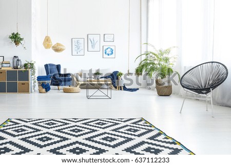 Modern living room with sofa, round chair and pattern carpet Royalty-Free Stock Photo #637112233