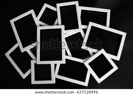 white frames cards for photos and inscriptions on a black background