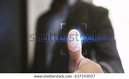 Businessman login with fingerprint scanning technology. fingerprint to identify personal, security system concept                                                                    Royalty-Free Stock Photo #637143037