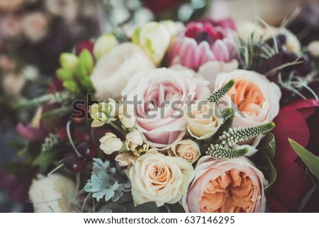 Roses in a brides flower bouquet Royalty-Free Stock Photo #637146295