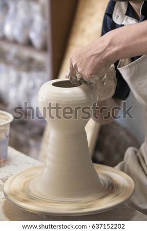 Potter makes pottery handmade in the workshop