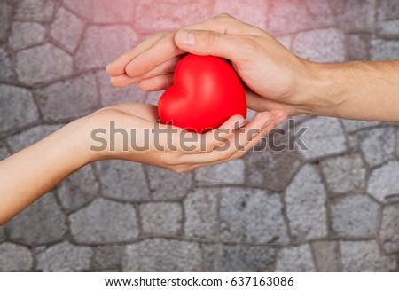 Hand holds heart. Royalty-Free Stock Photo #637163086