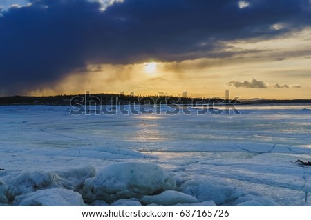 Beautiful winter sunset landscape with frozen sea