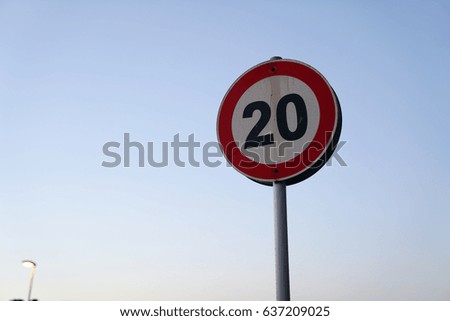 Red Frame Circle 20 speed  Limit Sign Board on blue sky Background