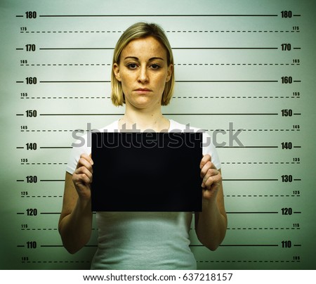 woman posing for police mugshot