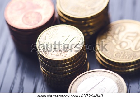 Euro money. Coins are isolated on a dark background. Currency of Europe. Balance of money. Building from coins. Coins of different values