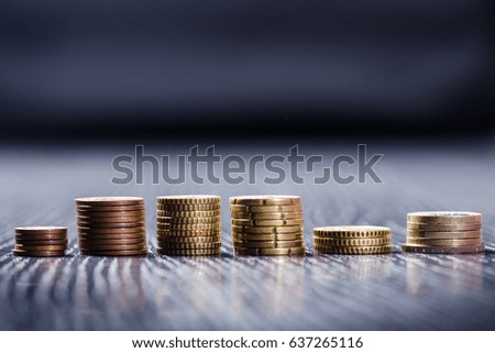 Euro money. Coins are isolated on a dark background. Currency of Europe. Balance of money. Building from coins. Coins of different values